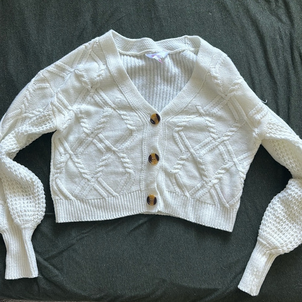 No Boundaries (NOBO) white knit sweater.